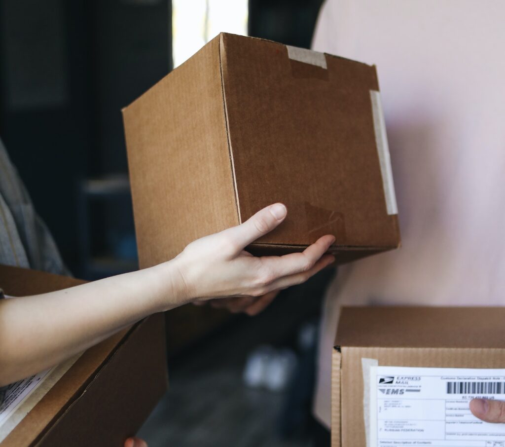 working in the removals industry, a person carrying boxes