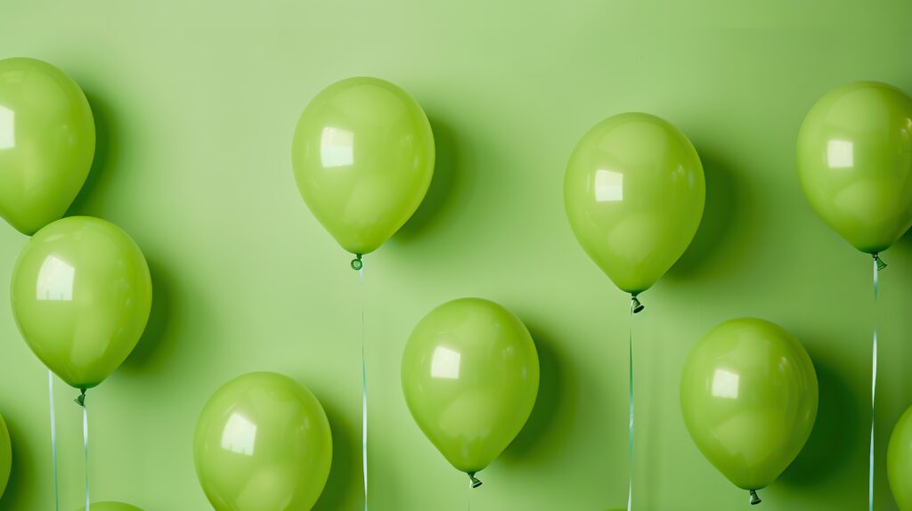 A collection of lime green birthday balloons to celebrate Oliver Rae's 5th Birthday, a recruitment agency in the West Midlands