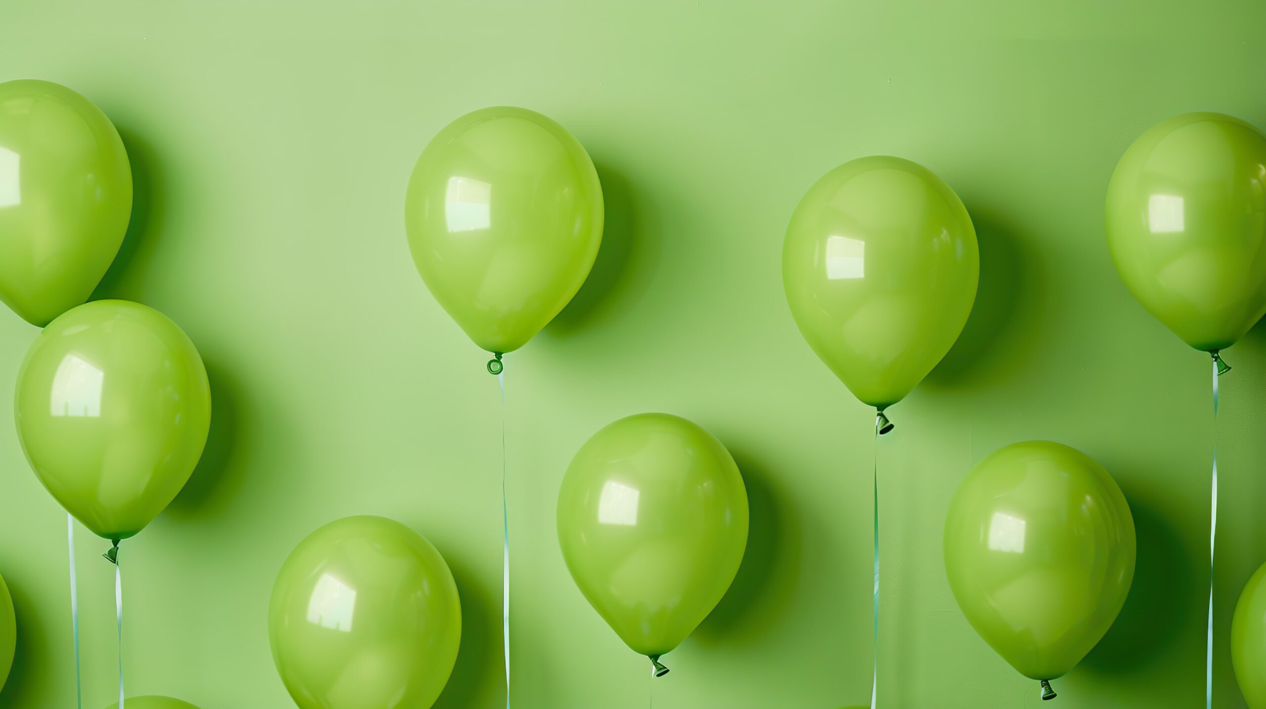 A collection of lime green birthday balloons to celebrate Oliver Rae's 5th Birthday, a recruitment agency in the West Midlands
